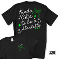 Black short-sleeve graphic T-shirt shown from the back and front. The back features white script text reading 'Kinda Chic to be a Starlette' with green bow and star accents.